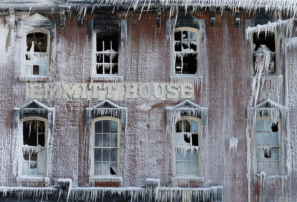 Story - 3rd place - The ice-blanketed remains of the Emmitt House in Waverly, Ohio still smolders a day after being destroyed by a fire. The restaurant, which was built in 1861 as a hotel by entrepreneur James Emmitt, had just reopened in August after being purchased and renovated by new owner Pam Ison.  (Adam Cairns / The Columbus Dispatch)