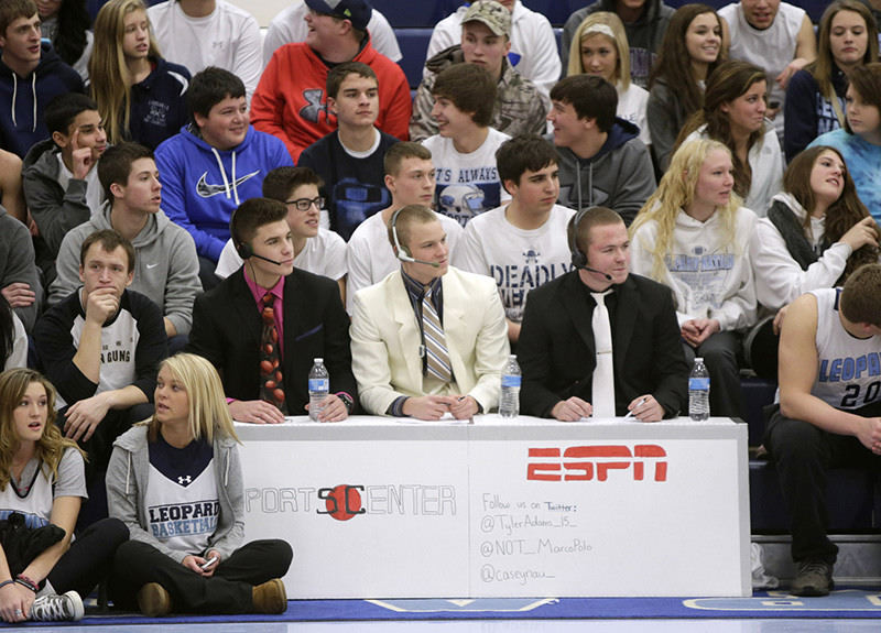 Sports Feature - 3rd place - Fans in the front row of the Louisville student section impersonated ESPN courtside personnel during their home game against Carrollton. (Scott Heckel / The (Canton) Repository)