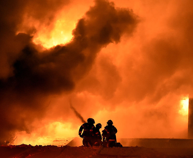 Spot News - 1st place - Members of the Springfield Fire Division battle a five alarm fire at Tri-State Pallet in downtown Springfield. (Bill Lackey / Springfield News-Sun)