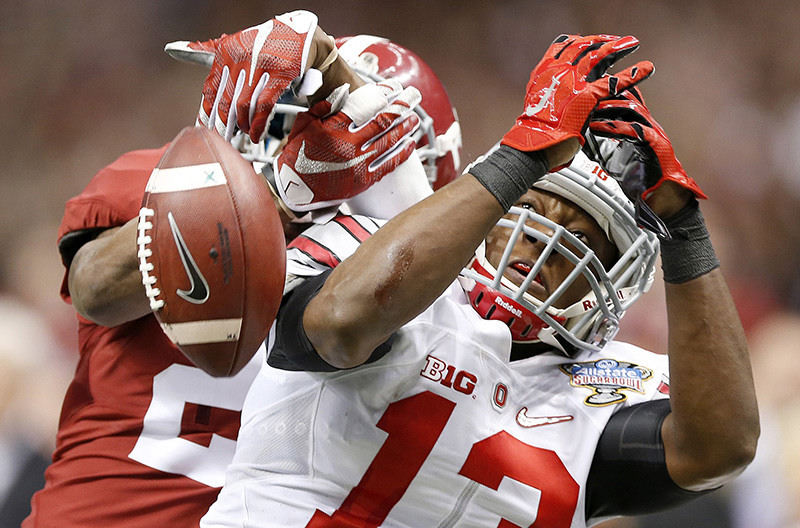 Sports - 2nd place - Ohio State cornerback Eli Apple (13) breaks up a pass for Alabama wide receiver DeAndrew White (2) during the fourth quarter in the Allstate Sugar Bowl at Mercedes-Benz Superdome in New Orleans. (Jonathan Quilter / The Columbus Dispatch)