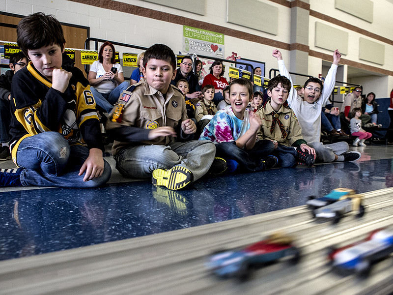 Story - 1st place - Weeblos cheer on their pinewood derby cars at Granville Intermediate School. (Jessica Phelps / The Advocate)