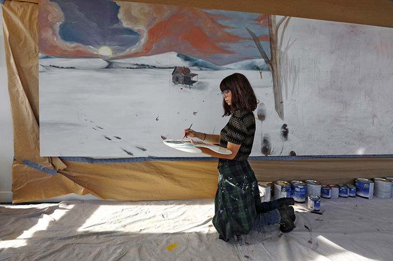 Portrait - HM - Artist Mandi Caskey is painting a mural on the wall of the Observation Deck of the James A. Rhodes State Office Tower Mandi started the 28 foot long 6 foot high mural in December and expects to complete it in five months.  (Tom Dodge / The Columbus Dispatch)