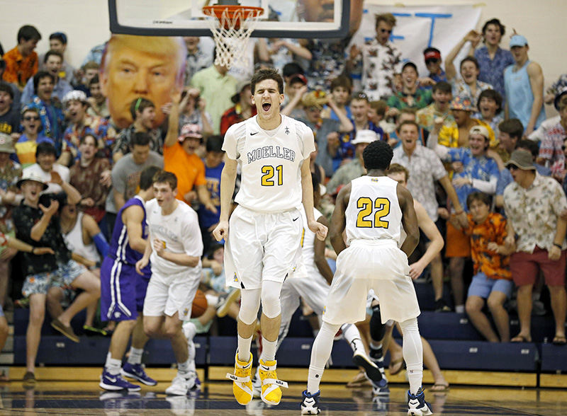 SSports Feature - HM - Moeller forward Sam McCracken celebrates after a Riley Voss dunk in the third quarter against the Elder Panthers at Moeller High School in Montgomery. Moeller defeated Elder 56-48. (Sam Greene / Cincinnati Enquirer)