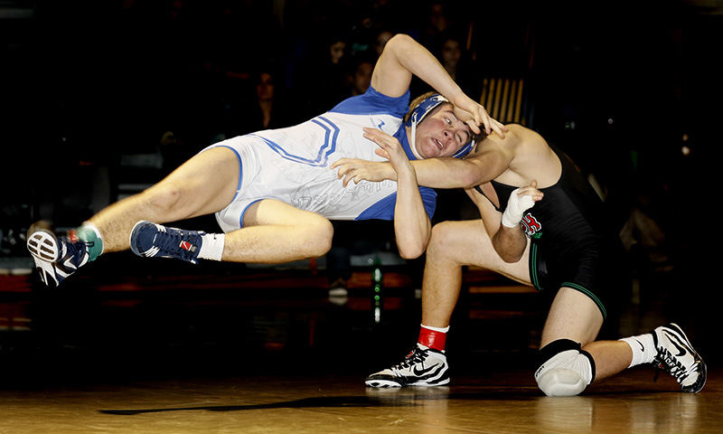 Sports - 2nd place - Defiance wrestler Grunden Gage (left) escapes from Rhett Peterson of Oak Harbor during their 145 pound final at the Perrysburg Invitational Tournament. Gage won the match 5-1.  (Andy Morrison / The (Toledo) Blade)