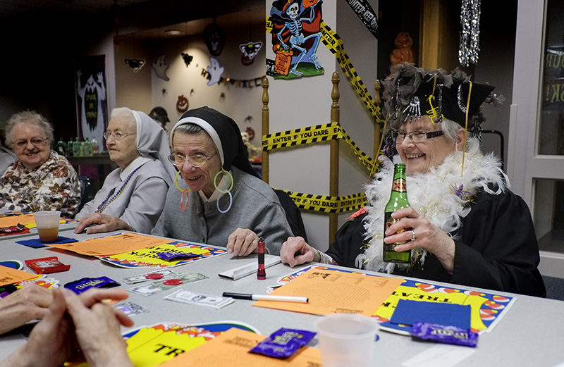    Story - 1st place - Enjoying a Halloween party are from left: Sr. Mary Mara Bennett, Sr. Mary Jamesetta Krafty, Sr. Mary Bryan Gabel, and Sr. Mary Sartor, at the Provincial Center.    (Andy Morrison / The (Toledo) Blade)