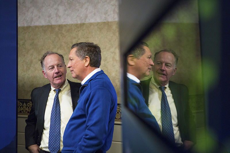 Story - 2nd place - Ohio Governor John Kasich talks to his friend and advisor, Bruce Berke, before a town hall in Concord, New Hampshire. Berke helped Gov. Kasich set up his town halls throughout the state.  (Meg Vogel / Cincinnati Enquirer)