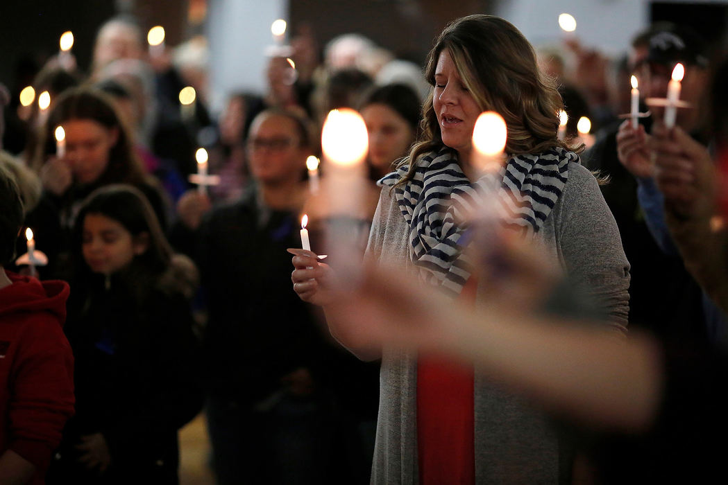 General News - 3rd placeCommunity members gather and pray during a vigil for Colerain Police Officer Dale Woods at the community center in Colerain. Woods was struck by a vehicle while responding to a separate car crash and remains in critical condition.  (Sam Greene/The Cincinnati Enquirer)