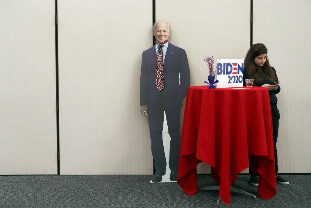 Feature - 3rd place - Ohio Wesleyan junior Fatima Iqbal, of Pakistan, waits for participants to cycle through to her station as she portrays former U.S. Vice President and Democratic presidential hopeful Joe Biden in a speed-dating-style event on campus that allows participants to meet each candidate and learn about their platforms. The event is one of several leading up to OWU's Democratic Mock Presidential Convention. (Shane Flanigan/ThisWeek Community News)