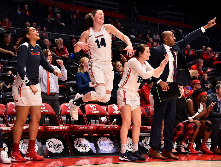 Sports Feature - HM - The Dayton Flyer bench reacts after a basket late in the second half of a close game against George Mason. The Dayton Flyers defeated Mason 59-55 at UD Arena in Dayton. (Erik Schelkun/Elsestar Images)