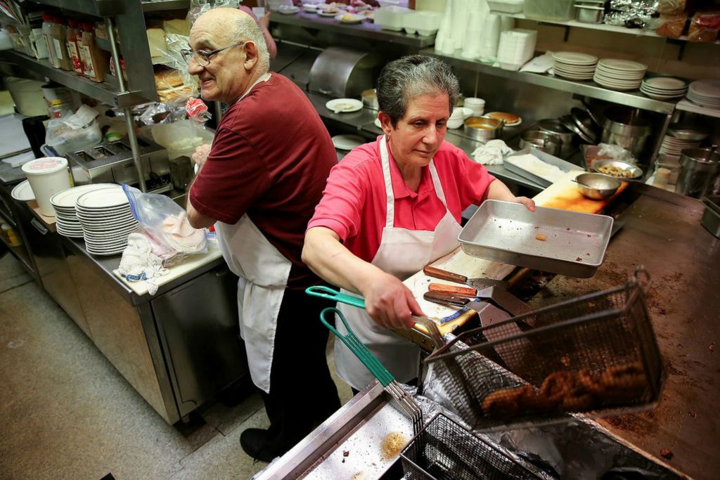 Story - 1st place - Chris and Stephanie Stone work in the 11 by 14 kitchen at Stone Family Restaurant in Cheviot. The couple is retiring and the neighborhood restaurant will close after first opening in 1962. (Kareem Elgazzar/The Cincinnati Enquirer)