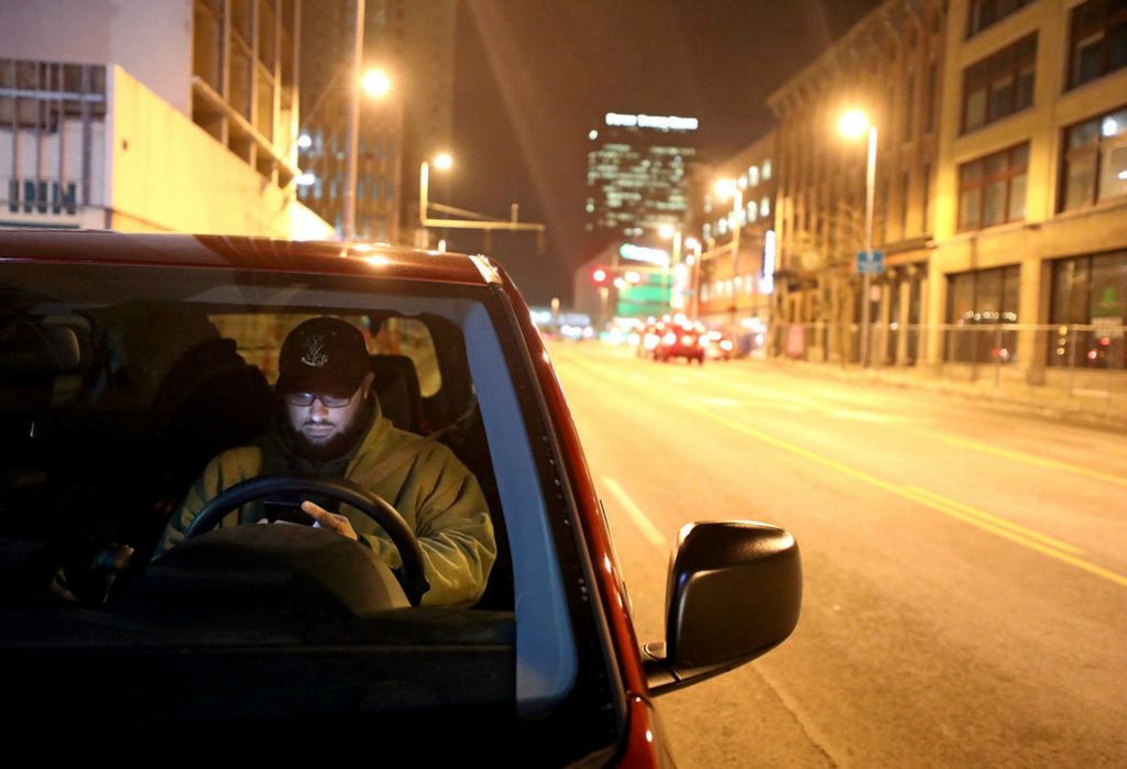 Story - 2nd place - Eric Lorenzen, with Neighborhood Properties/Projects for Assistance in Transition from Homelessness (PATH) Outreach, digitally logs one of the homeless people they talked to along Summit Street during the Toledo/Lucas County Homelessness Board's point-in-time count of the local homeless population in Toledo. (Kurt Steiss/The Blade)