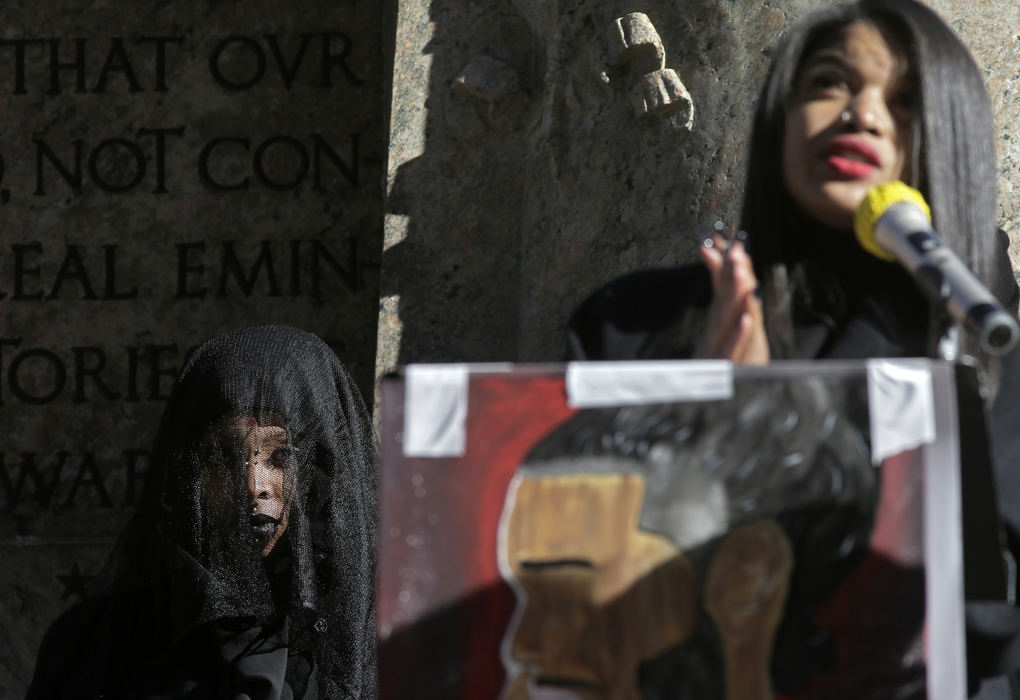 General News - 1st place - Dressed in a black veil, Maya Brown (left) of Westerville listens to organizer and Ohio University student Marijé Rivers, 18, speak during a Last Stand Rally at the Ohio Statehouse in Columbus. The peaceful demonstration called for action from Ohio's elected representatives to legislate for accountability and transparency from law enforcement. (Barbara J. Perenic / The Columbus Dispatch)