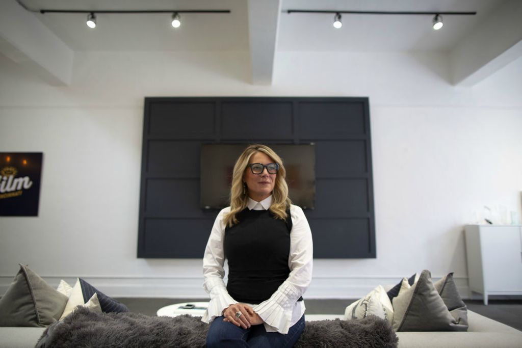 Portrait - 3rd place - Kristen Schlotman, executive director of Film Cincinnati, sits in her Race Street office in the Over-the-Rhine neighborhood of Cincinnati. Schlotman helped bring feature film productions like "Ides of March", "Killing of a Sacred Deer" and "Carol" to Cincinnati in the past decade.  (Sam Greene / The Cincinnati Enquirer)