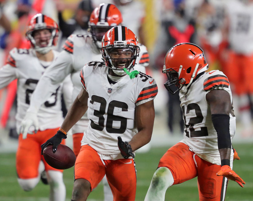 Sports Feature - 1st place - Cleveland Browns cornerback M.J. Stewart (36) celebrates with teammates after picking off Pittsburgh Steelers quarterback Ben Roethlisberger during a wild-card playoff football game in Pittsburgh. (Jeff Lange / Akron Beacon Journal)