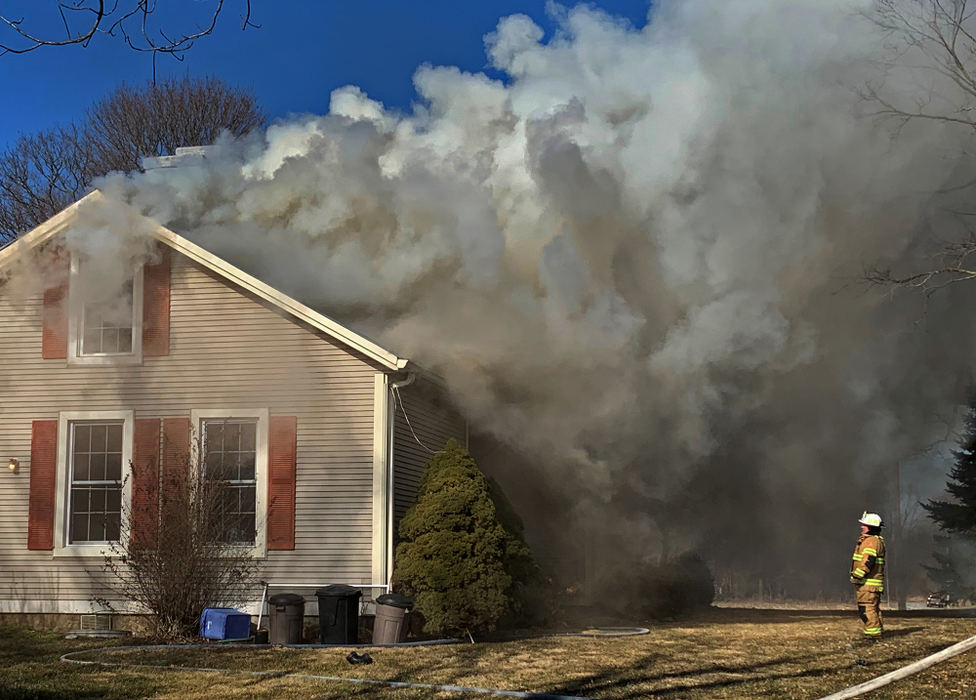 Spot News - 3rd place - Firefighters from several departments in eastern Clark County responded to a house fire in the 2800 block of Newlove Road. The residents were not home at the time of the fire. There were no injuries in fire. The two story home, reportedly over 100-years-old, suffered extensive damage.  (Bill Lackey / Springfield News-Sun)