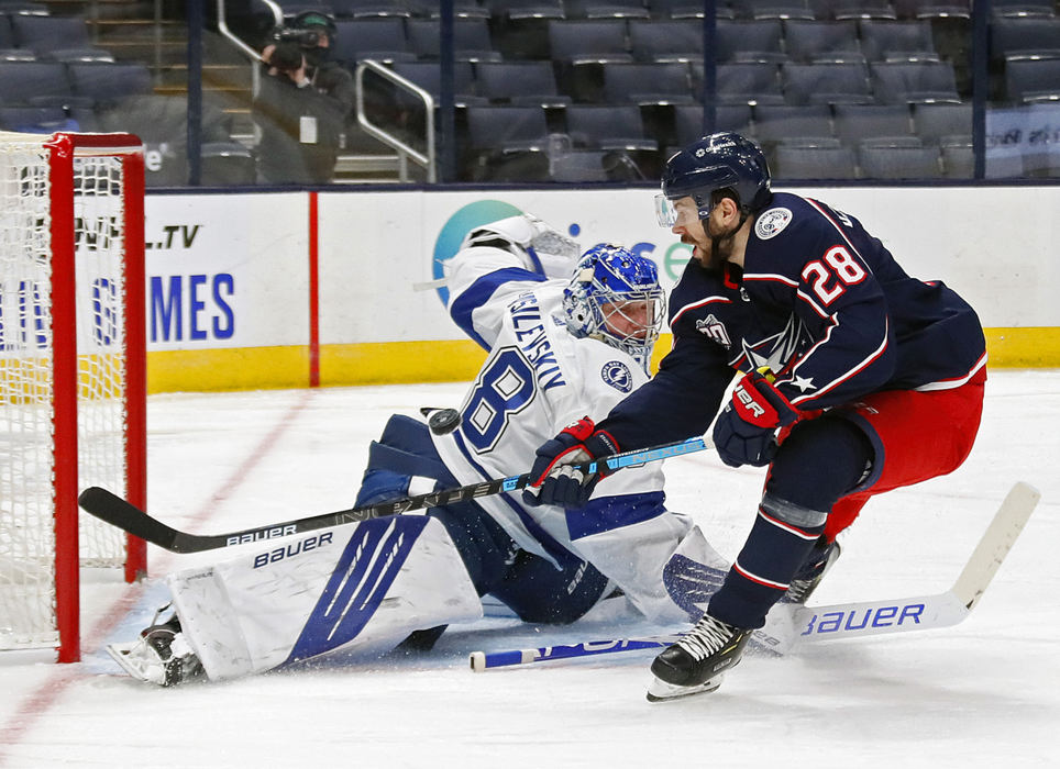 Sports - 2nd place - Columbus Blue Jackets right wing Oliver Bjorkstrand (28) shot is blocked by Tampa Bay Lightning goaltender Andrei Vasilevskiy (88) in the third period during their NHL game at Nationwide Arena in Columbus. (Kyle Robertson / The Columbus Dispatch)