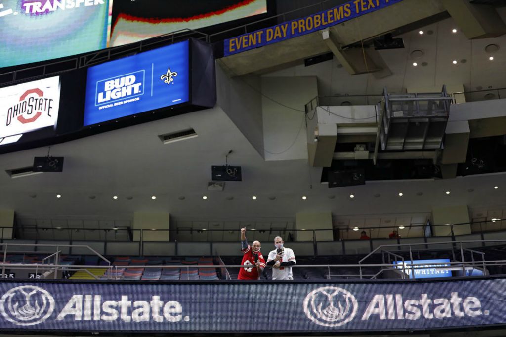 Story - 1st place - Ohio State fans cheer as the team enters the  Mercedes-Benz Superdome before taking on Clemson Tigers during the College Football Playoff semifinal at the Allstate Sugar Bowl in New Orleans. (Kyle Robertson / The Columbus Dispatch)