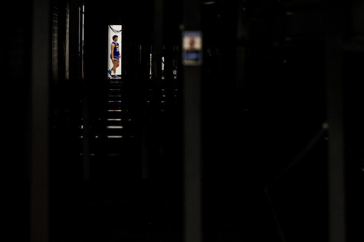 Sports Feature - 1st place - Findlay’s Luke Montgomery walks onto the floor in a game against Southview during the Martin Luther King Jr. Showcase at Rossford High School.  (Isaac Ritchey / The Blade)