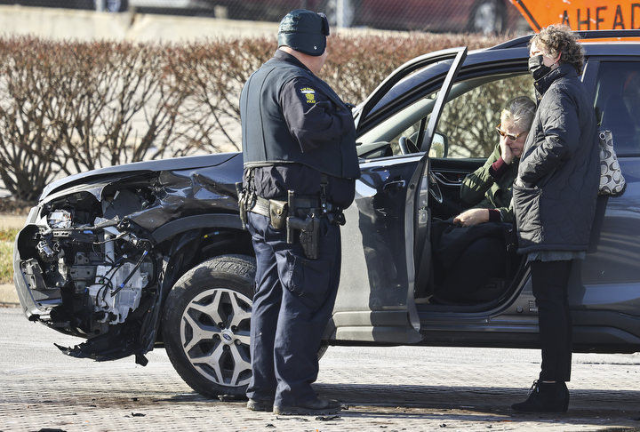 Spot News - 1st place - A woman reacts to being involved in a two car accident at the intersection of Monroe Street and 14th Street in Toledo.  (Jeremy Wadsworth / The Blade)