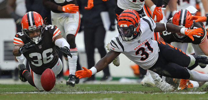 Sports - 2nd place - Cleveland Browns cornerback M.J. Stewart (36) dives on an onside kick against Cincinnati Bengals defensive back Michael Thomas (31) during the fourth quarter of an NFL game at FirstEnergy Stadium in Cleveland.  (Jeff Lange / Akron Beacon Journal)