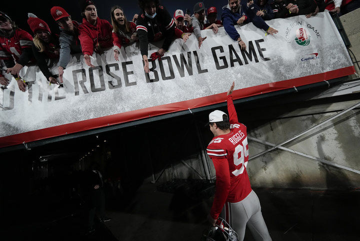 Story - 1st place - Ohio State place kicker Noah Ruggles (95) waves to fans as he leaves the field following the team’s 48-45 win over Utah in the Rose Bowl. Ruggles kicked the game-winning field goal.  (Adam Cairns / The Columbus Dispatch)