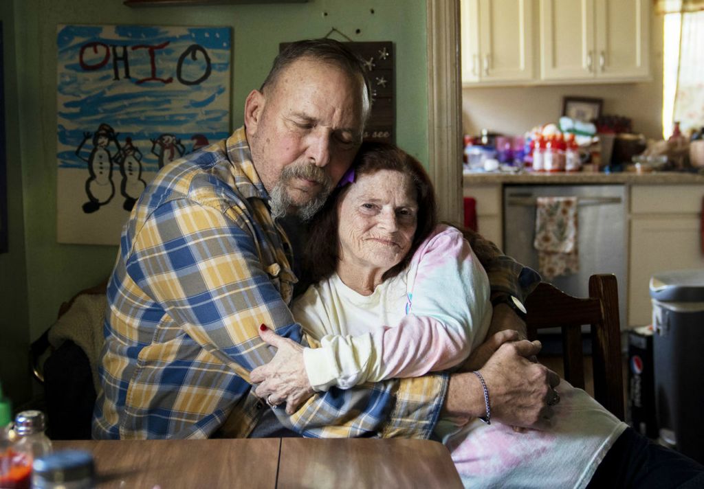 Portrait - 1st place - Bill and Debbie Goode sit for a portrait in their home. Debbie was diagnosed with Alzheimers Disease six years ago, Bill is her primary caretaker. Debbie takes painting classes through the Alzheimer's Association and collects pennies and other coins. (Brooke LaValley / The Columbus Dispatch)