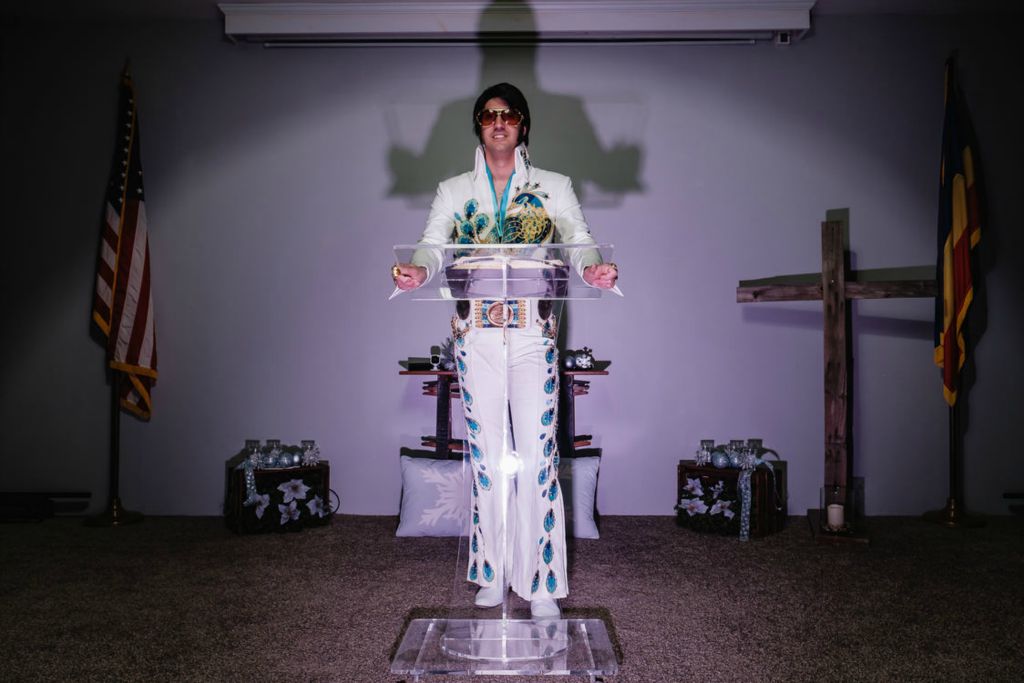 Portrait - 3rd place - Michael Brindley, Pastor of Organic Church in Uhrichsville, poses in an exact replica of the peacock jumpsuit worn by Elvis Presley. Brindley puts on Elvis shows, and from time to time interjects faith teachings into those shows. (Andrew Dolph / The Times Reporter)