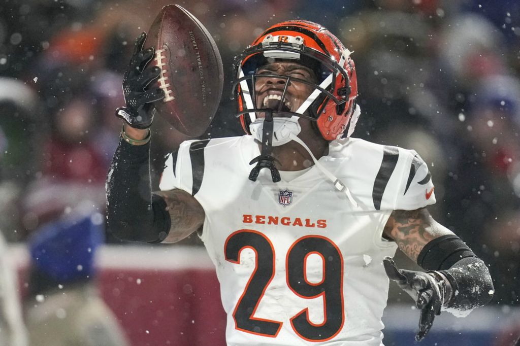 Sports Feature - 2nd place - Cincinnati Bengals cornerback Cam Taylor-Britt (29) celebrates after intercepting a pass to seal a Bengals win in the fourth quarter against the Buffalo Bills at Highmark Stadium in Orchard Park, N.Y. The Bengals won 27-10 to advance to the AFC Championship game against the Kansas City Chiefs. (Sam Greene / The Cincinnati Enquirer)