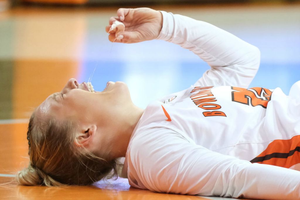 Sports - 3rd place - Bowling Green State University guard Lexi Fleming screams in pain after being injured during the first half of a game against Kent State in Bowling Green.  (J.D. Pooley / Sentinel-Tribune )