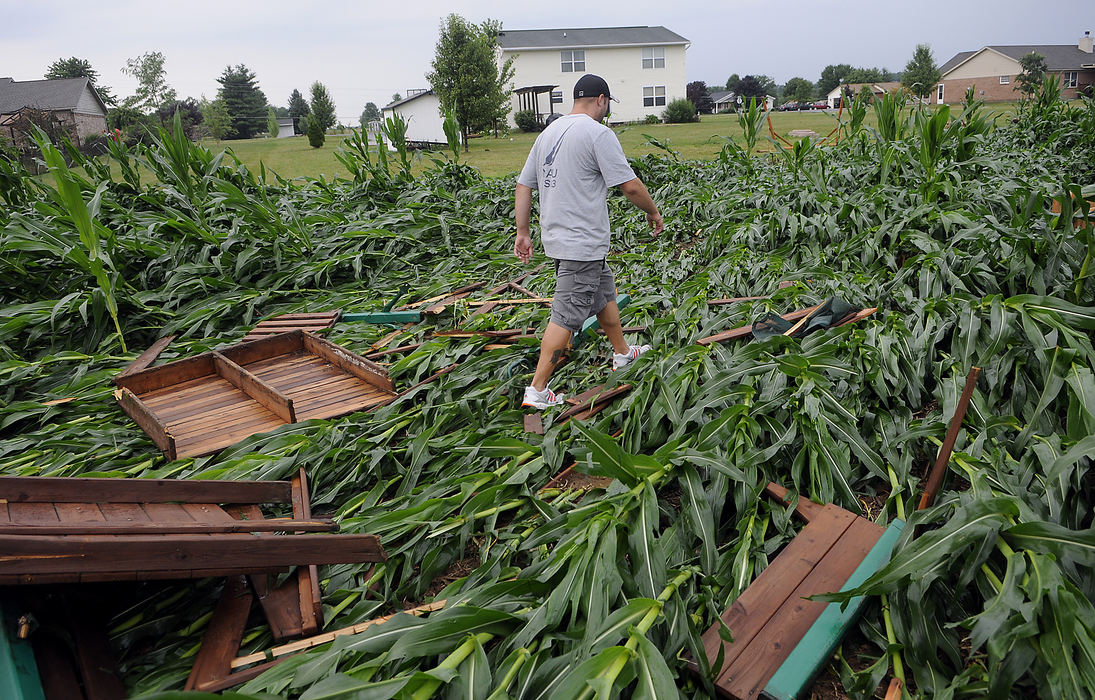 Spot News - 2nd place - Severe thunderstorms with high winds rolled through northern Clark County and part of Champaign County with home on Crabill and Burnett Roads among the hardest hit. with eight utility poles down, trees destroyed and ross damaged. (Marshall Gorby / Springfield News-Sun)