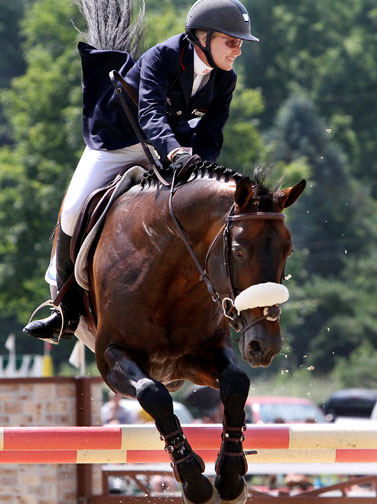 Sports - HM - Candice King rides Toronto, owned by AAA Equestrian, in the second round to win the $30,000 Cleveland Grand Prix at the 2011 Chagrin Valley Hunter Jumper Classic at the Cleveland MetroParks polo field   in Moreland Hills. (Peggy Turbett / The Plain Dealer)