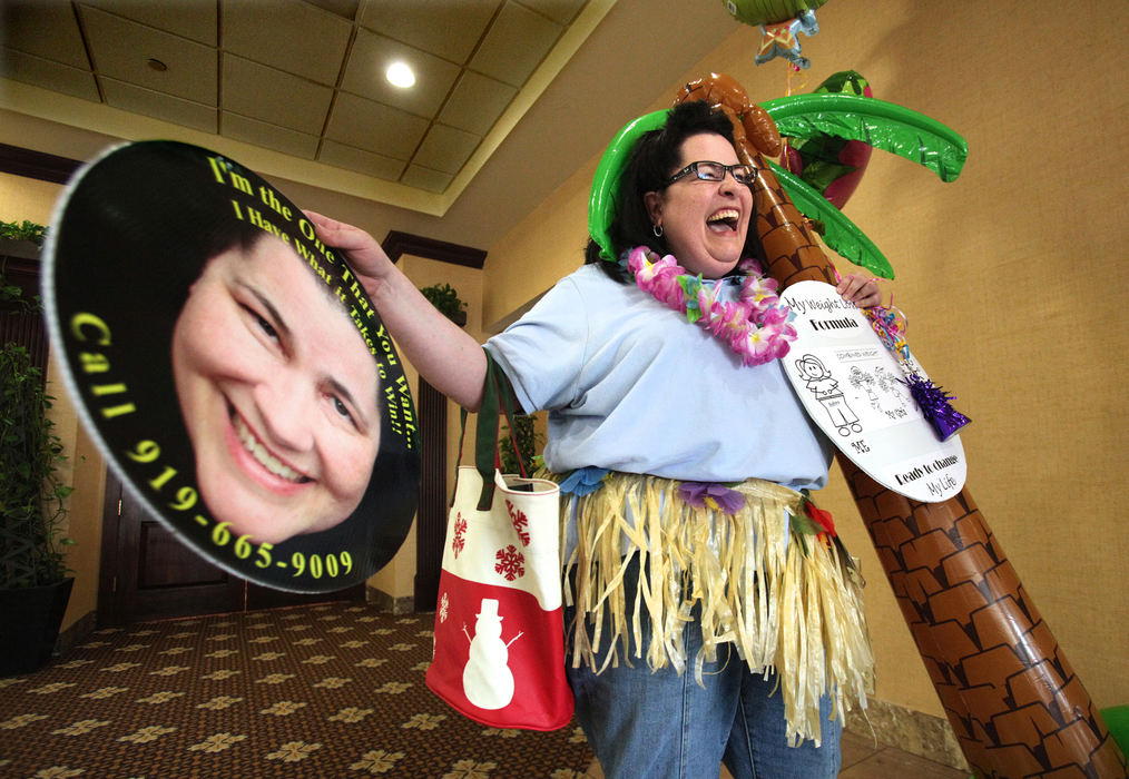 General News - 2nd placeCindy Archer, 44, of Raleigh, North Carolina, laughs as she does a hula dance after just finishing her audition for the NBC TV show "The Biggest Loser" at the Plaza Cleveland South hotel in Independence.  (Lisa DeJong  / The Plain Dealer)