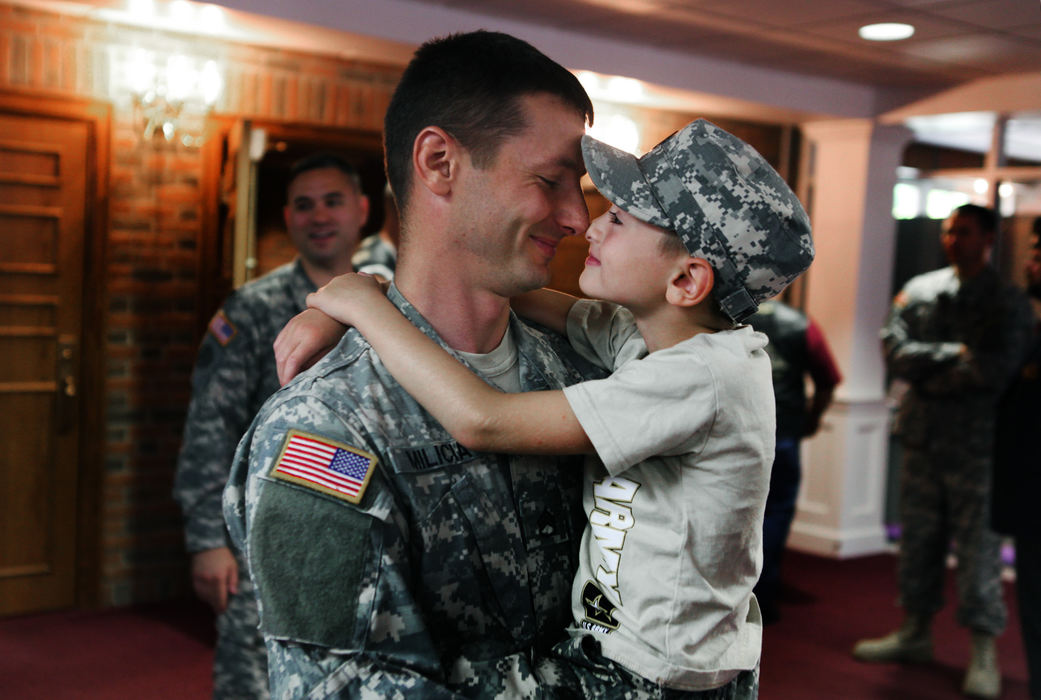 General News - HMStaff Sargent James Milicia, of Fredericktown, goes nose to nose with his son Angelo Milicia ,7, after a Call to Duty Ceremony for the Operational Mentor and Liaison Team  at Reynoldsburg United Methodist Church. James who has served multiple deployments will be serving in Afghanistan.  (Eric Albrecht / The Columbus Dispatch)