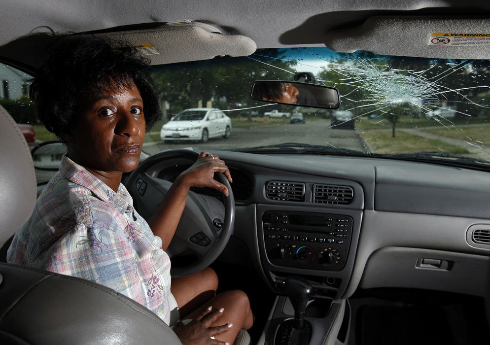 Portrait - 2nd placeJacqueline Roane had a rock smash into her front windshield of her Ford Taurus near I-71 and Rt. 161 in Columbus. The perpetrator has shattered the windshields of at least two vehicles we know of.  Now Roane can't drive her car around looking for jobs.  (Kyle Robertson / The Columbus Dispatch)