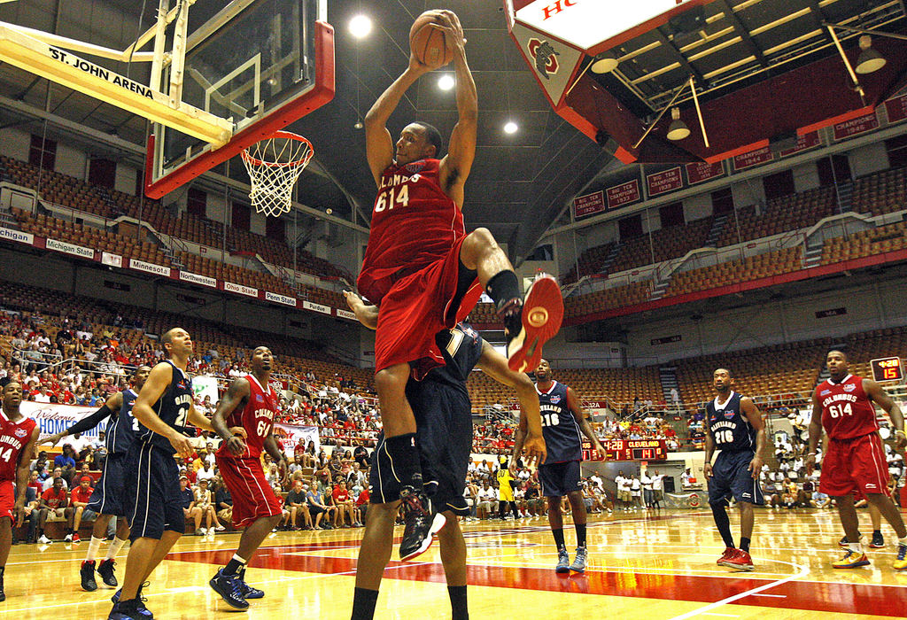 Sports - 1st placeEvan Turner, former basketball player at Ohio Sate University, dunks during the "Battle for Ohio" charity basketball game at the St. John Arena.  (Brooke LaValley / The Columbus Dispatch)