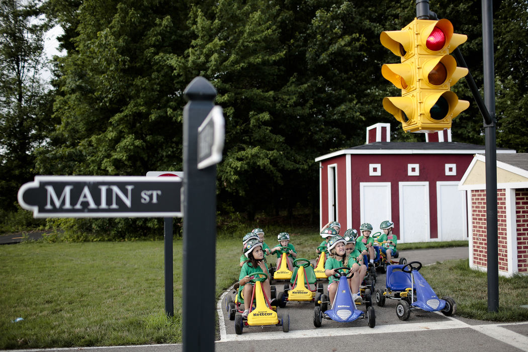 Feature - 1st placeStudents in Mrs. Courtney Worley's Safety Town class wait for the light to change at the intersection of High and Main streets at the New Albany Safety Town. During the summer class, kids learn about road safety as well as public safety, and the class includes trips to the police and fire departments. (Joshua A. Bickel / ThisWeek Community News)