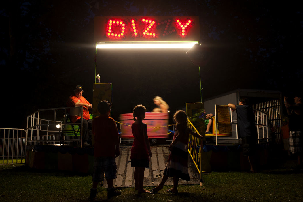 Feature - HMYoung children wait in line to ride the Dizzy during the Latrobe Midway fair on July 4 at Legion Keener Park in Latrobe, PA. (Daniel Kubus / Ohio University)