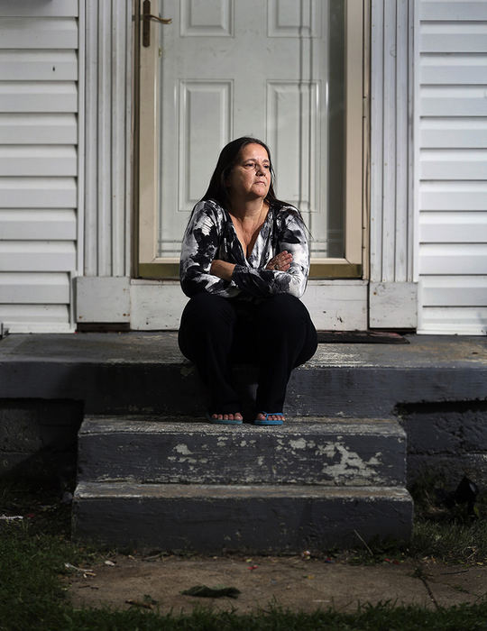 Portrait - 3rd place - Eileen Fyffe's looks at the spot that her daughter, Crystal, was gunned down in her front yard in 2011.  Crystal's boyfriend, Robert Ledbetter, has been charged with murdering her. That charge was part of the 25-count indictment in federal court against members of the Short North Posse. (Kyle Robertson / The Columbus Dispatch)