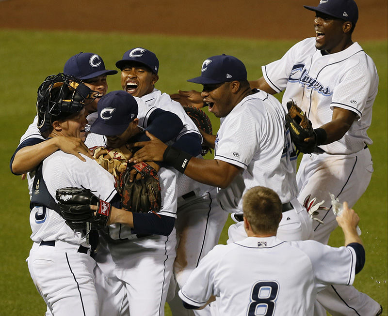 Sports Feature - 2nd place - Tyler Cloyd (25) of the Columbus Clippers is mobbed by teammates after pitching a no-hitter against the Louisville Bats at Huntington Park The Clippers won the game 13-0. Cloyd's feat was the 19th no-hitter in franchise history. (Barbara J. Perenic / The Columbus Dispatch)