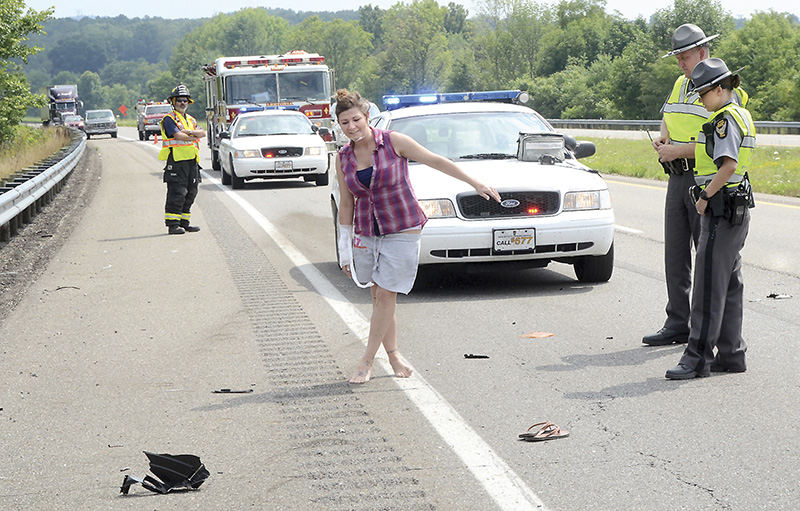 Spot News - 3rd place - Thirty-year-old Amanda Carrigan of Wheeling, W.Va. was cited for OVI and assured clear distance after driving her 2001 Honda Civic into the back of a semi tractor-trailer on state Route 11.  After refusing transport, Carrigan was given a field sobriety test by troopers Jodi Bolen and Brian Kavanagh at the scene and taken into custody where she was transported to the Lisbon Post for a urine test.  (Patricia Schaeffer / The (Lisbon) Morning Journal)