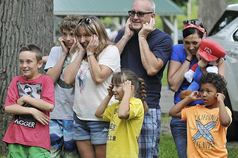 General News - 3rd place - Spectators cover their ears as a canon goes off during the Red, White and Blues in the Park Festival at Aumiller Park.   (Mitchell Pe Masilun / The (Mansfield) News Journal)