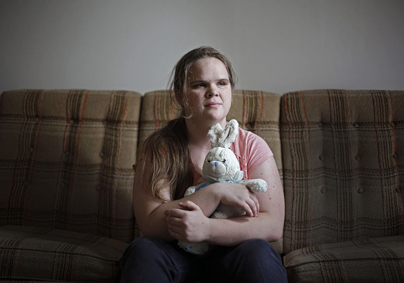 aPortrait - 1st place - Aleeha Dudley who is blind and has been sexually assaulted for years by her brother poses for a photo in her apartment in Columbus.  Her family and even the police in her hometown ignored her for years.   (Kyle Robertson / The Columbus Dispatch)