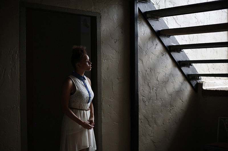 Portrait - 2nd place - Makkedah Cutshall, 19, poses for a photograph in the front doorway of her apartment in Reynoldsburg. Due to Ohio law Cutshall aged out of foster care at 18 as opposed to 21 like she would have in many other states. Makkadeh said the extra years would have really helped her save instead of being forced to like paycheck to paycheck as she works full time. The inability to save for a car has her taking the bus two hours each way to work. Her dream is to become a model someday.  (Eamon Queeney / The Columbus Dispatch)