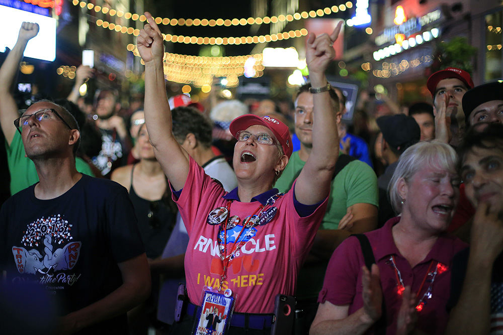 Story - 1st place - Trump support Cheryl Surber from Fort Worth, Texas cheers as she watches Donald Trump accepted the Republican presidential nomination on day four of the Republican National Convention in Cleveland. (Kyle Robertson / The Columbus Dispatch)