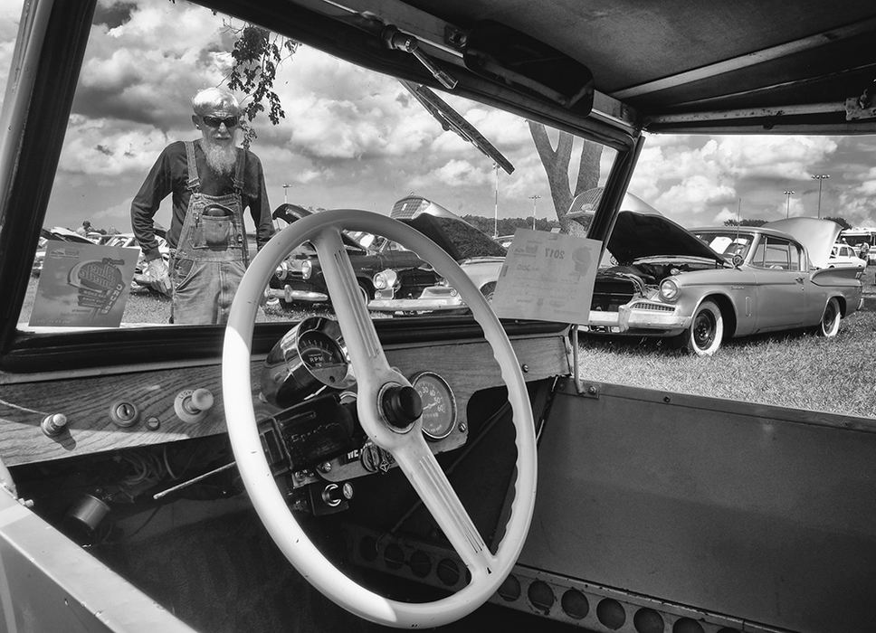    Portrait - 1st place - Ron Wagner looks at 1959 King Midget on display at an auction of old cars and trucks  at Summit Motorsports Park in Norwalk.  (Jeremy Wadsworth / The Blade)