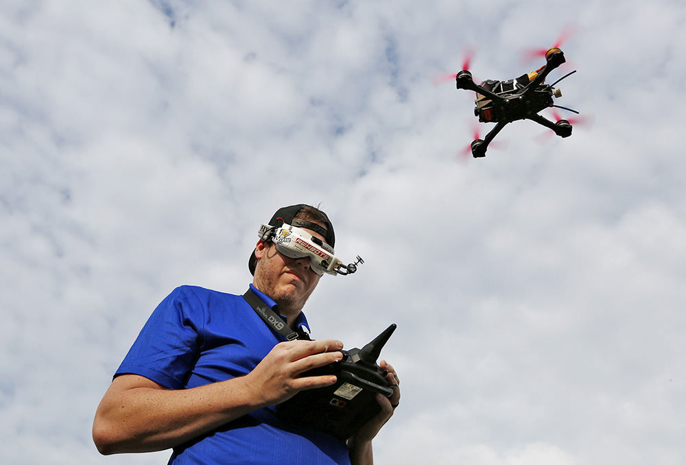 Portrait - HM - AJ Goin is a professional drone pilot who competes in races via the Drone Racing League (airing on ESPN). He is shown in his goggles that allow him to see what a camera attached to his drone sees as he races.  (Fred Squillante / The Columbus Dispatch)