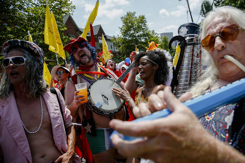 MTStory - 2nd place - Parade marchers sing the Star-Spangled Banner as they prepare to march during the Doo Dah Parade in Columbus.  (Joshua A. Bickel / The Columbus Dispatch)