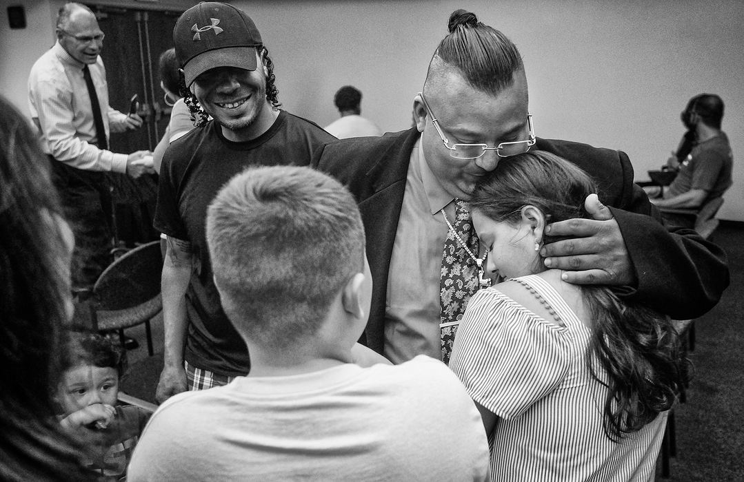 General News - 1st placeDrug Court Program graduate Ruben Rangel hugs his daughter Savannah Rangel, 11, after the Lucas County Adult Drug Court program graduation in Toledo. (Jeremy Wadsworth/The Blade)