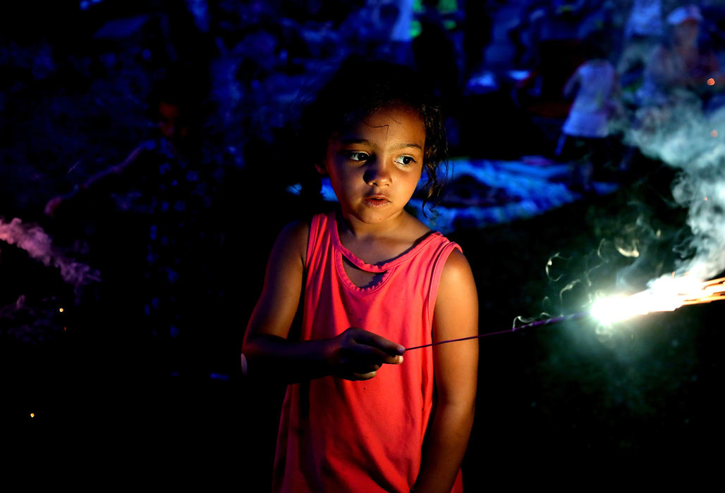 Portrait - 3rd placeIsabel Cutwright, 7, of Toledo, uses a sparkler ahead of fireworks during an early Independence Day celebration at Fort Meigs in Perrysburg. (Kurt Steiss/The Blade)