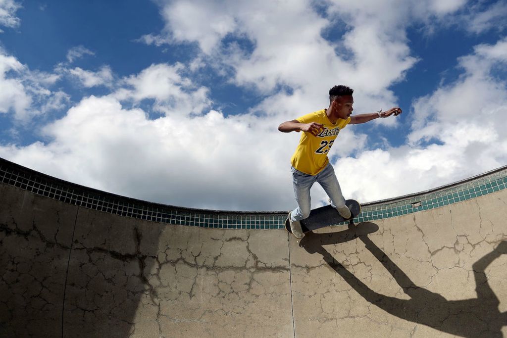 Feature - 3rd place - Osten McDaniel, of Powell, rides around the edge of Adventure Park's skate pool in Powell. (Shane Flanigan / ThisWeek Community News)